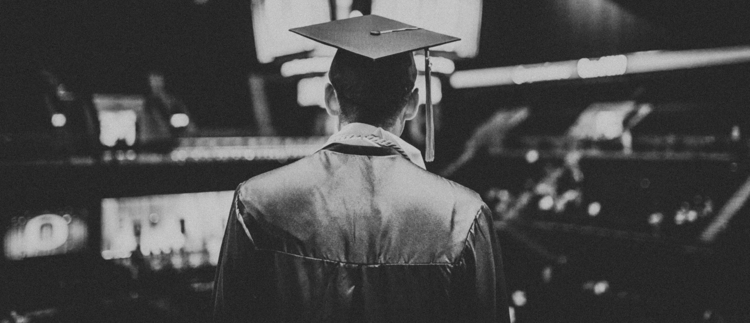 the back of someone graduating in a cap and gown