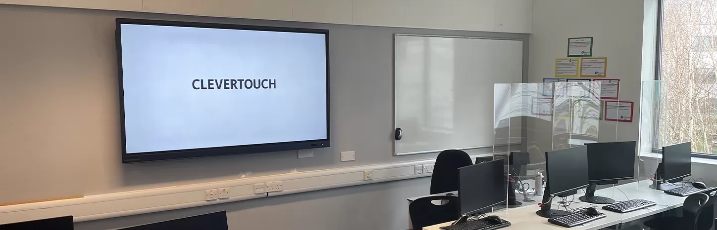 Clevertouch IMPACT Plus on the wall in an IT classroom