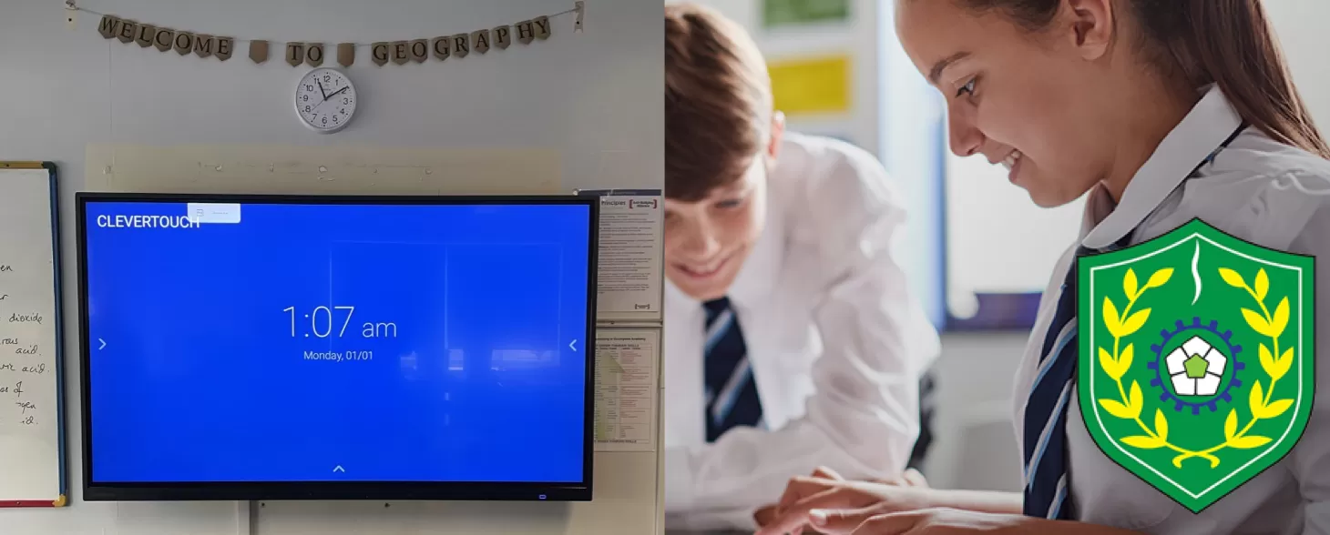 two students smiling and a Clevertouch IMPACT display
