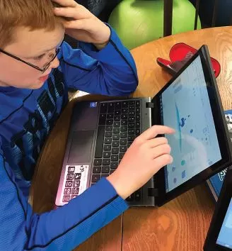 student using robo on a laptop