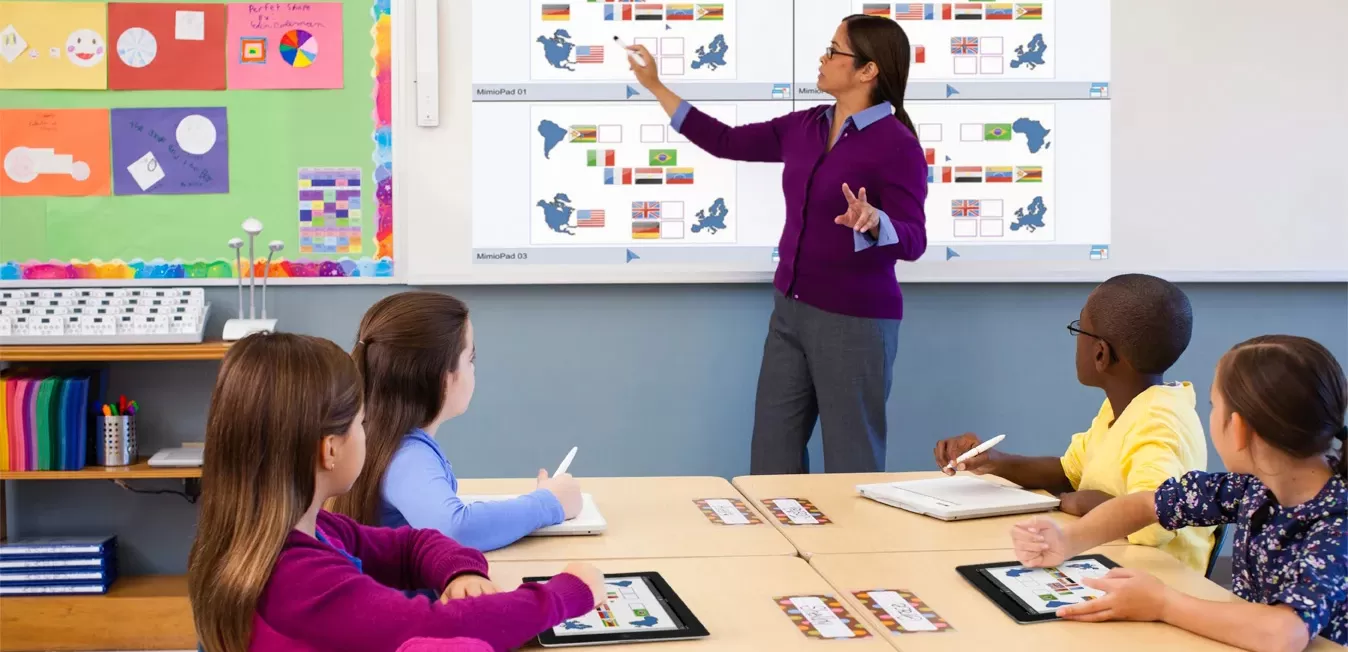 teacher using mimioTeach, student using MimioPad Wireless Pen Tablets and two other tablets