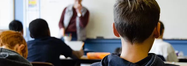 photo of students in a class from the back