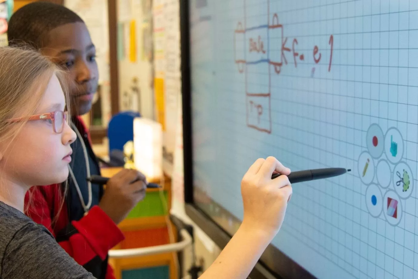 students writing on a lynx-whiteboard