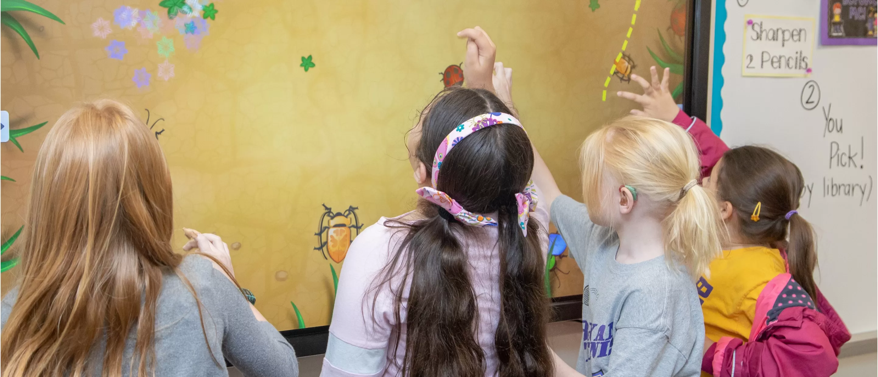 students using a Clevertouch IMPACT Plus screen