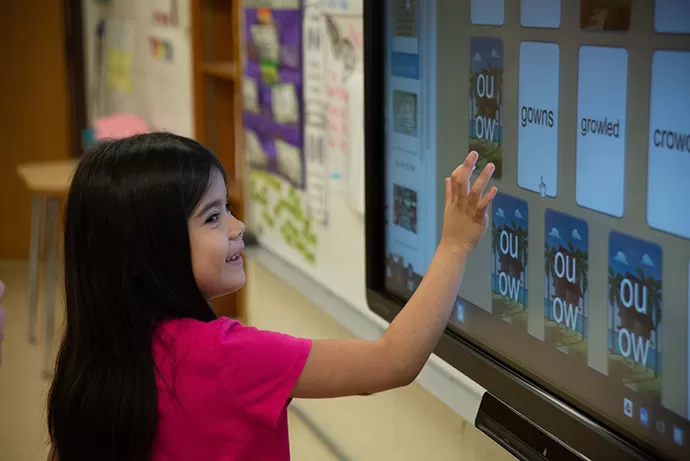 Student using an app from mimio market to learn another language