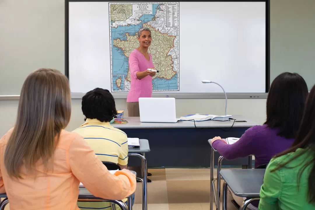 MimioView 350U Document Camera being used to film a textbook and project onto a whiteboard