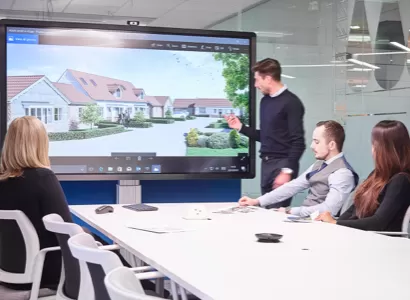 A large screen display being used in a meeting room