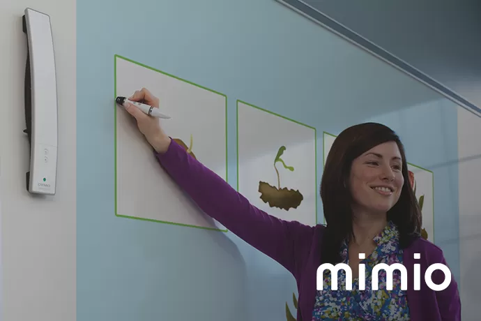 teacher using the MimioTeach with 'mimio' in the bottom right corner