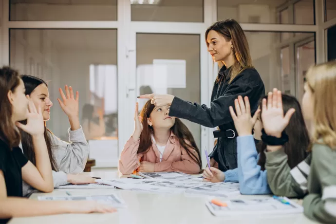 group of students having a discussion round a table