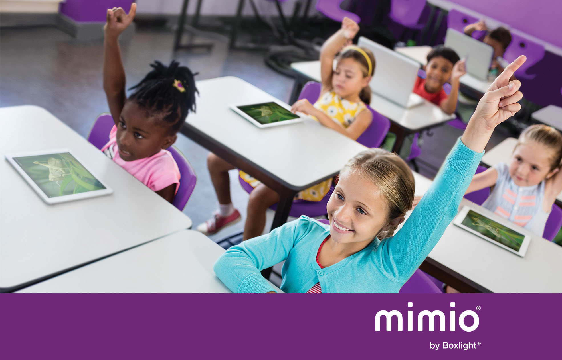 students raising their hands in class and a purple banner with the mimio logo along the bottom