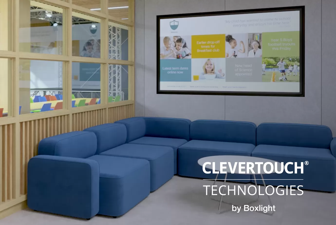 a school sofa/lobby area with CM series digital signage display on the wall and clevertouch logo in the bottom right