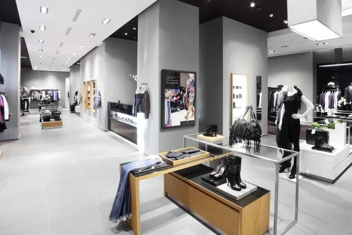 clothes shop using digital signage to show customers a range
