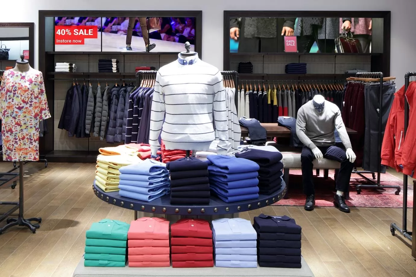 Clothes shop using digital signage to tell customers about a sale