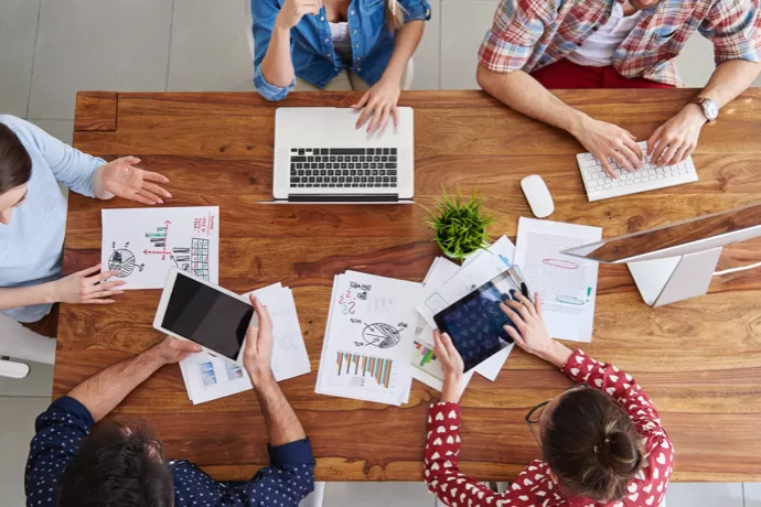 bird's eye view on people having a meeting