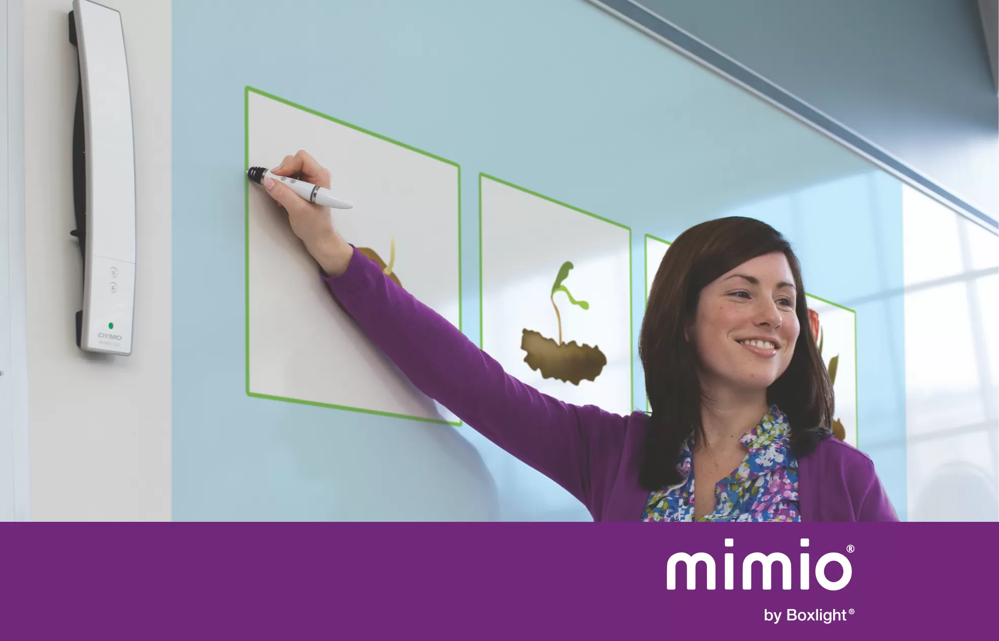 teacher using the MimioTeach with purple banner saying 'mimio by boxlight' at the bottom