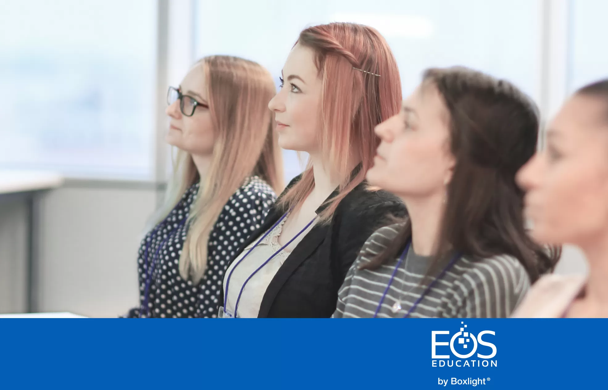 a line of people sitting with a blue banner and the EOS logo along the bottom