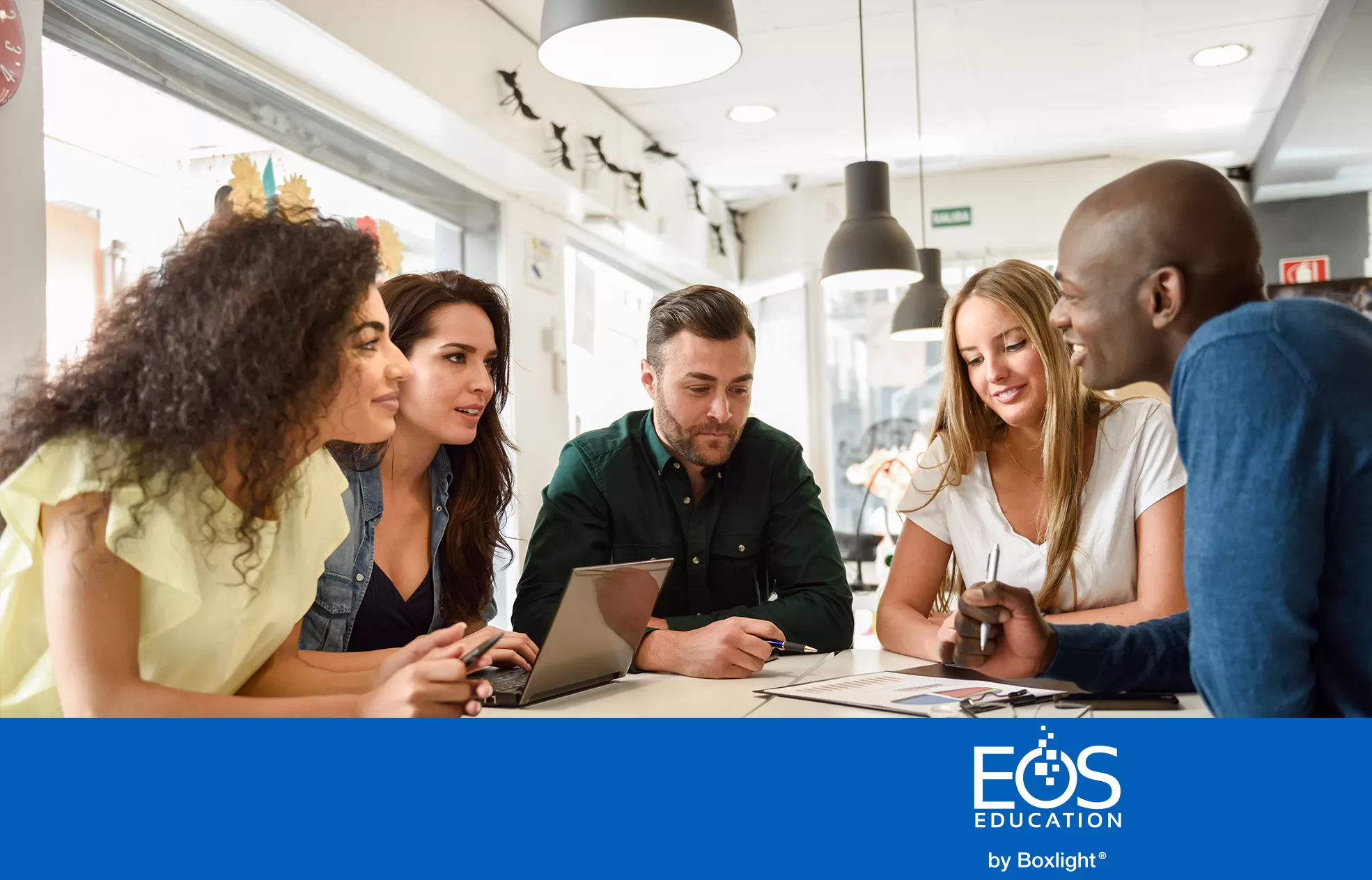 people round a table having a discussion with EOS logo in a blue banner at the bottom