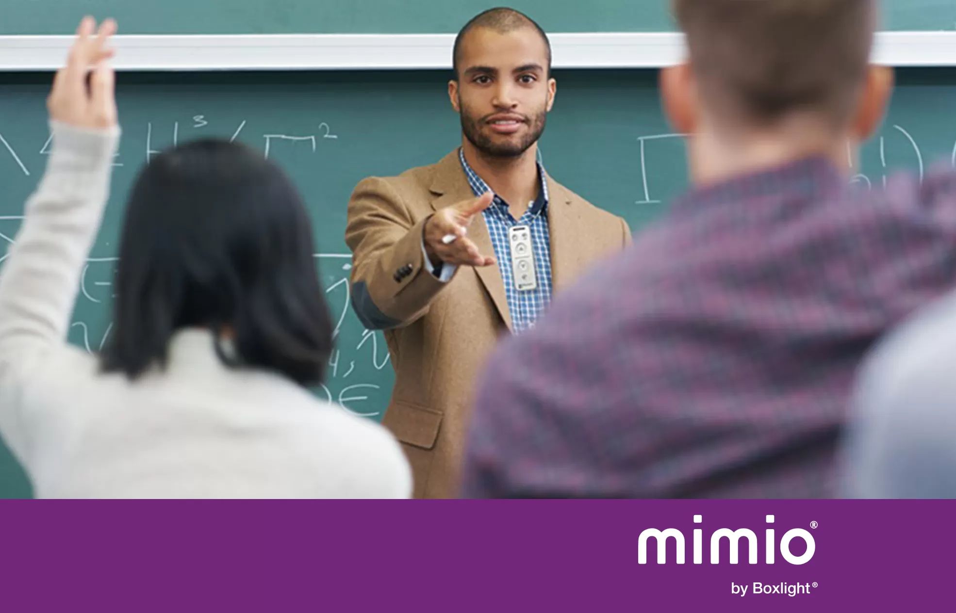 teacher using a MimioClarity microphone with purple banner saying 'mimio by Boxlight' at the bottom