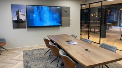 medium size meeting room with Clevertouch UX Pro display screen on the wall